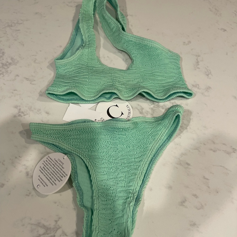NEW CLEONIE Bikini. Cute one shoulder. Pet free smoke free home. One SIZE!
